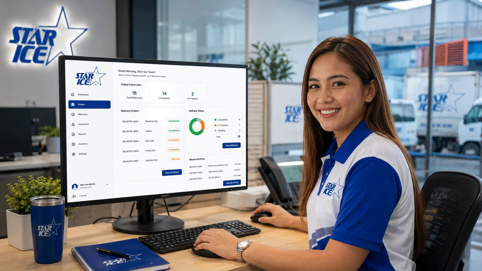 Smiling Star-Ice dispatch staff member using the operations dashboard on a desktop computer